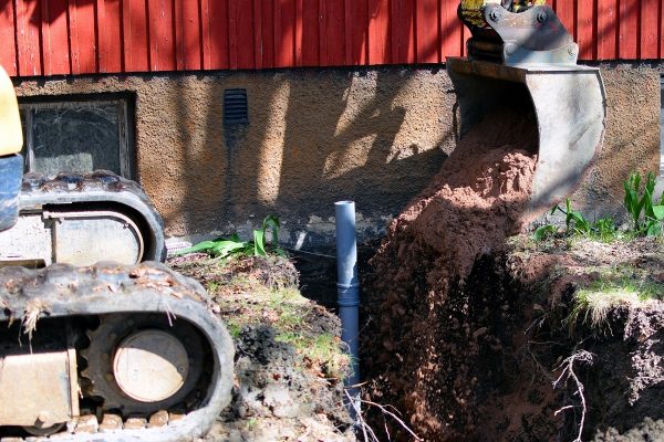 filling the sewer pipe trench