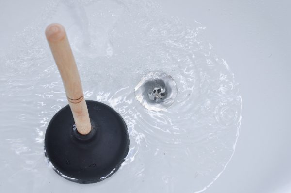 Plunger and clogged bath drain